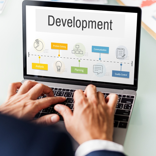 Web profile development concept showing business professional working on laptop with development process chart